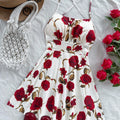 Soleia spaghetti strap mini dress with an open back and a romantic red floral print