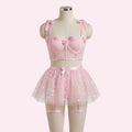 طقم PetitDoll من 4 قطع: تنورة من التول الشبكي مزينة بزهور على شكل قلوب، مع فيونكة وجوارب شبكية بتصميم لطيف.