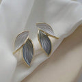 SHEIN blue and white gradient French stud earrings with a falling leaf design